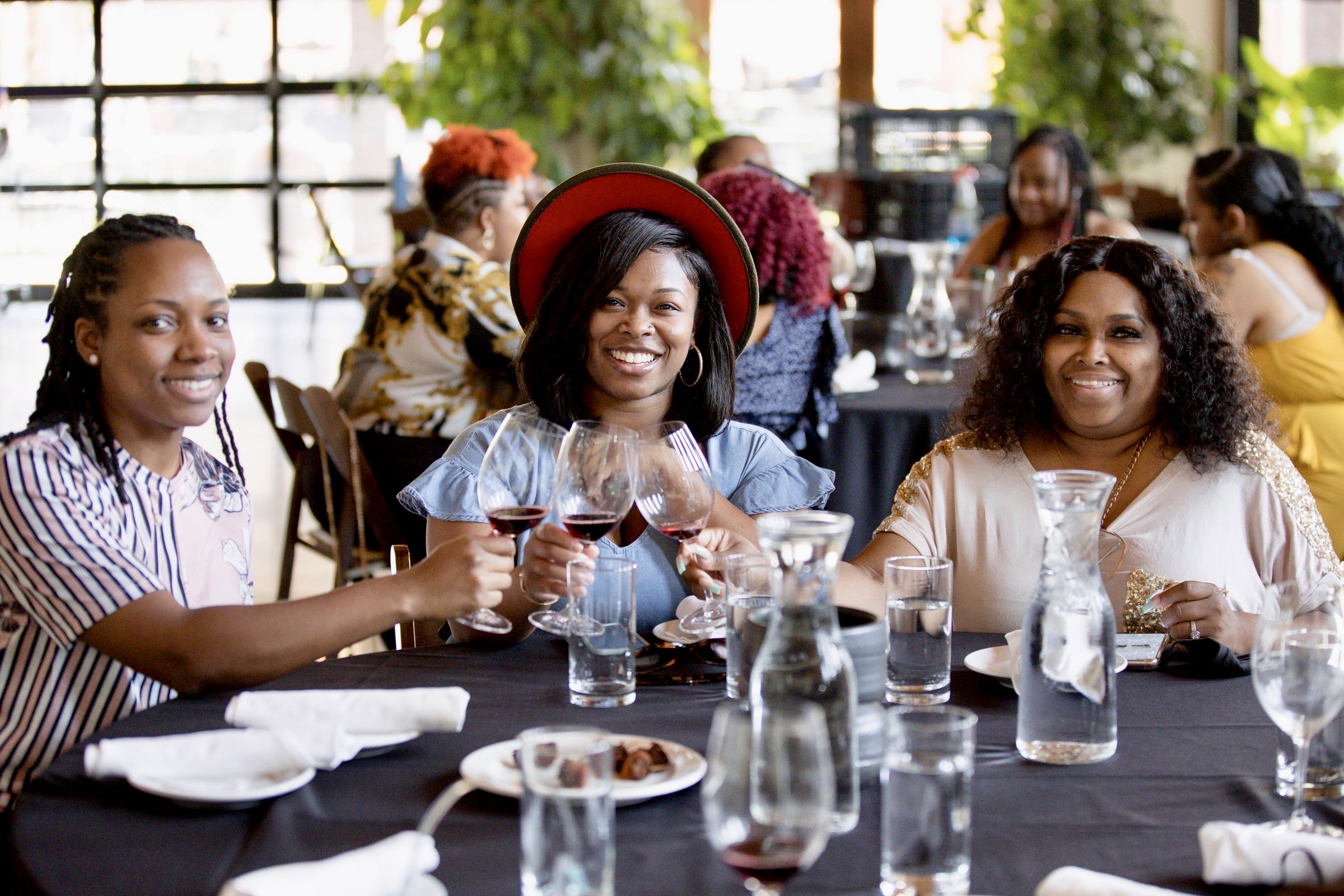 Three African American women on a wine tasting tour in Colorado